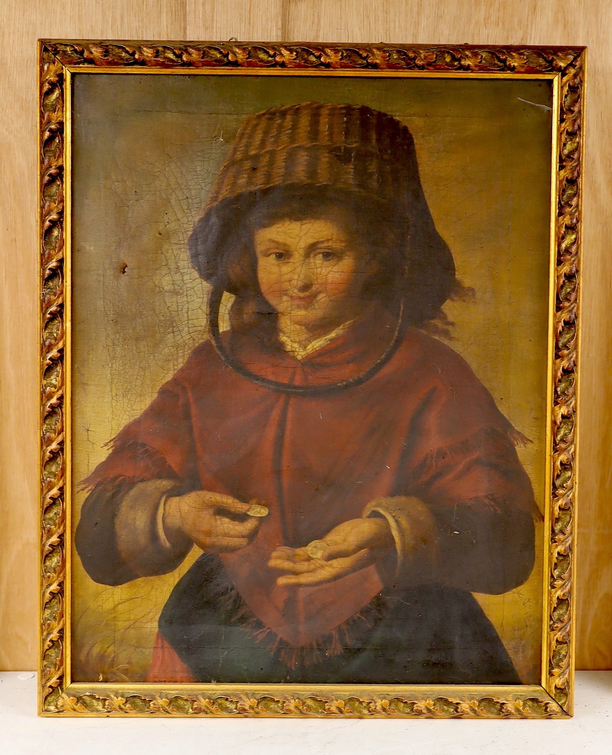 19th century Flemish School, oil on canvas, Portrait of a woman counting money wearing a basket as a hat, 49 x 38cm